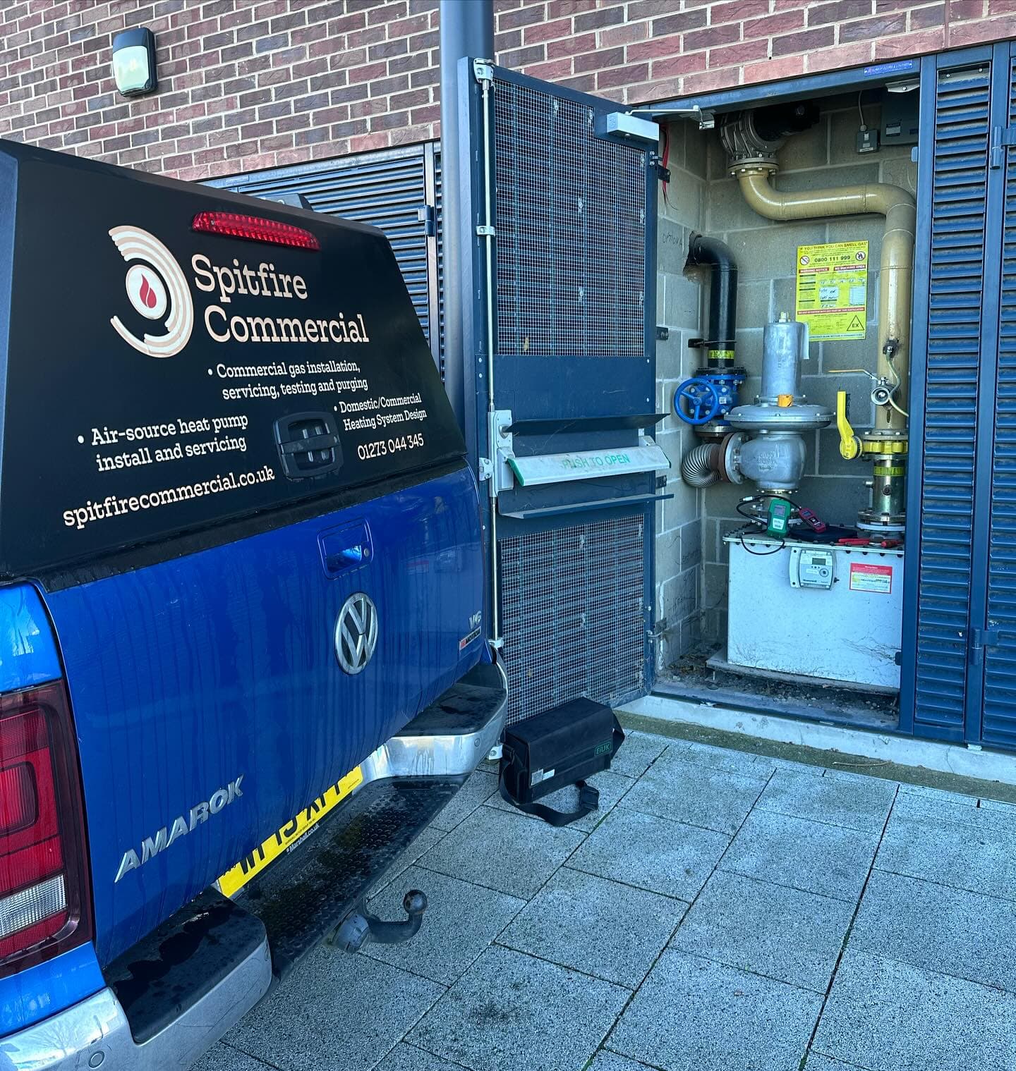 Spitfire Commercial branded van parked at a school gas cage during whole-site gas testing