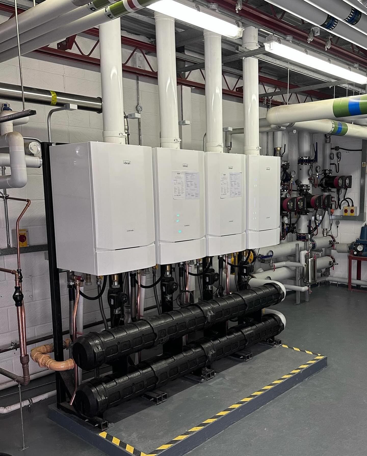 Rebuilt plant room at Portchester Community School with a four-boiler Ideal cascade and black insulated headers